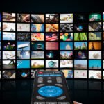 TV with pictures of smart television and remote control,close up.